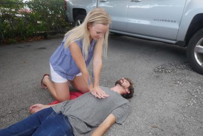 First-Response-Woman-Give-Chest-Compressions-Photo-2